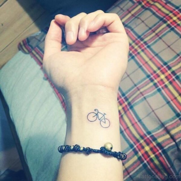 Small Cycle Tattoo On Wrist