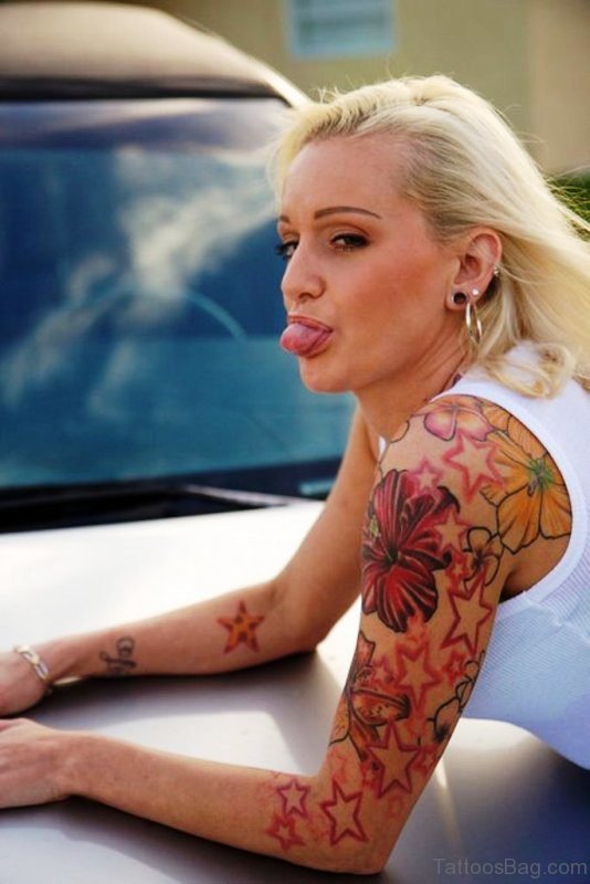 Small Flower Tattoo On Girl Shoulder