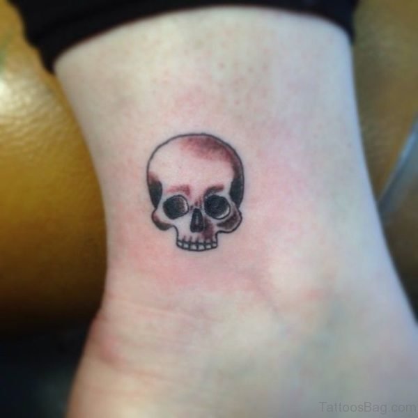 Small Grey Ink Skull Tattoo