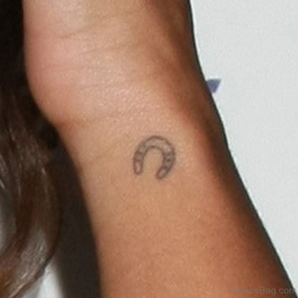 Small Horse Shoe Tattoo On Wrist