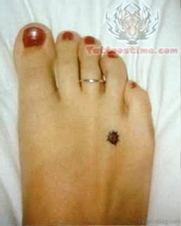 Small Ladybug Tattoo On Foot