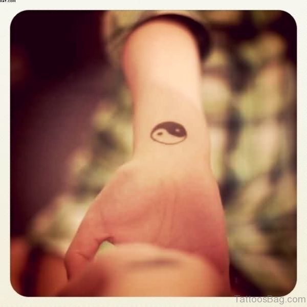 Small Yin Tattoo On Wrist