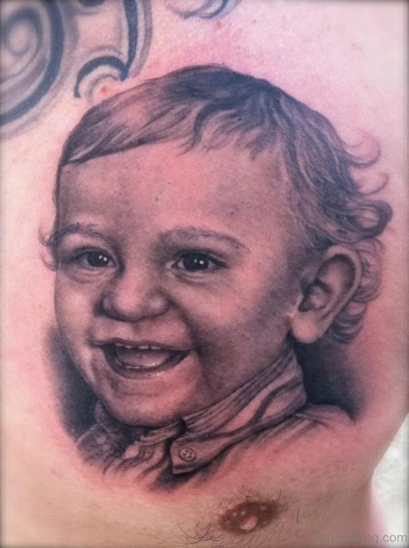 Superb Baby Portrait Tattoo On Chest