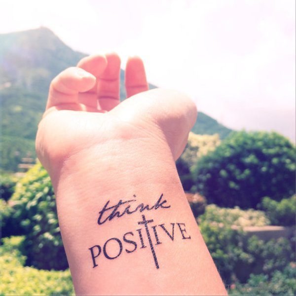 Think Positive Cross Tattoo On Wrist
