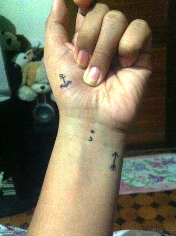 Tiny Arrow Tattoo