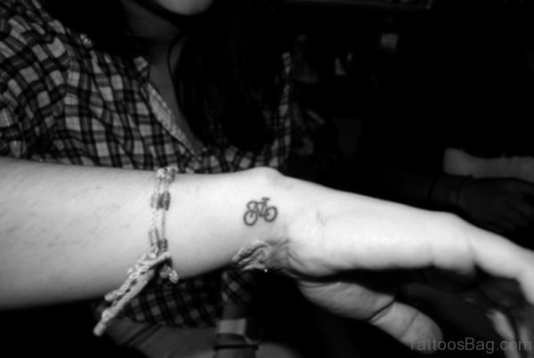 Tiny Cycle Tattoo On Wrist