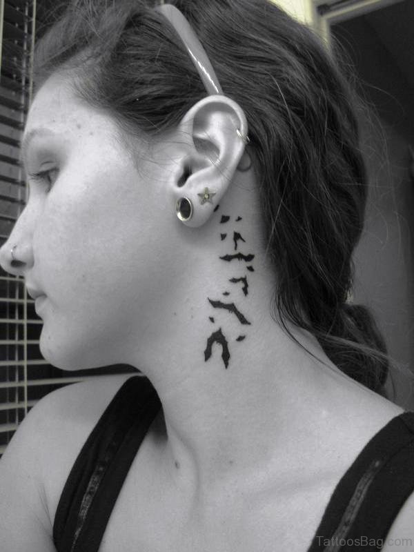 Tiny Flying Bats Tattoo Behind Ears