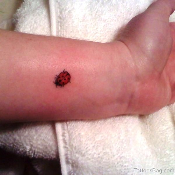Tiny Ladybug Wrist Tattoo 