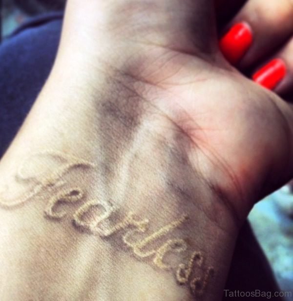 White Fearless Wrist Tattoo