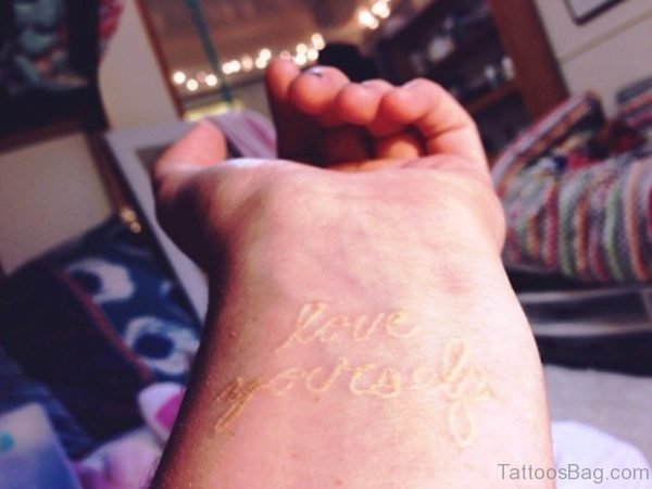 White Love Yourself Wrist Tattoo