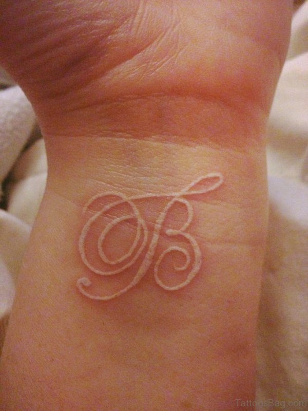 White Wrist Intial Tattoo