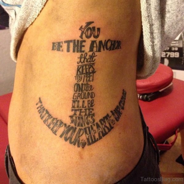 Wording And Anchor Tattoo On Rib