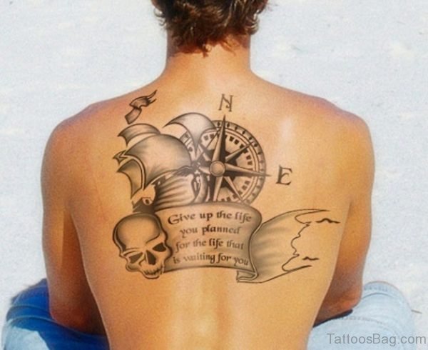 Compass tattoo with ship skull on upper back
