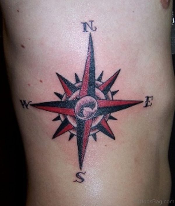Red Compass Tattoo On Rib