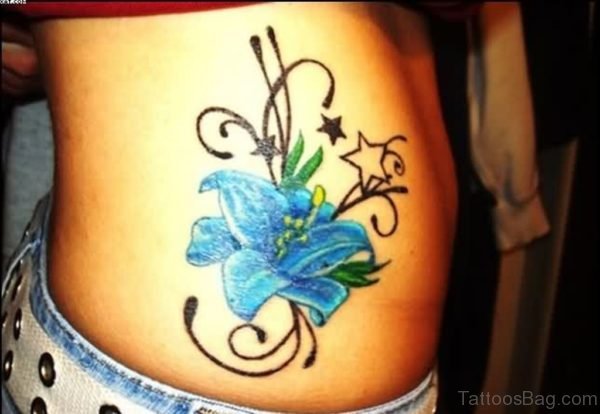 Amazing blue Lily flower waist tattoo