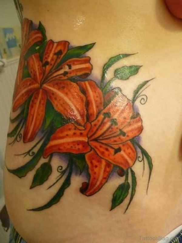 Attractive Lily Flowers Tattoo On Waist