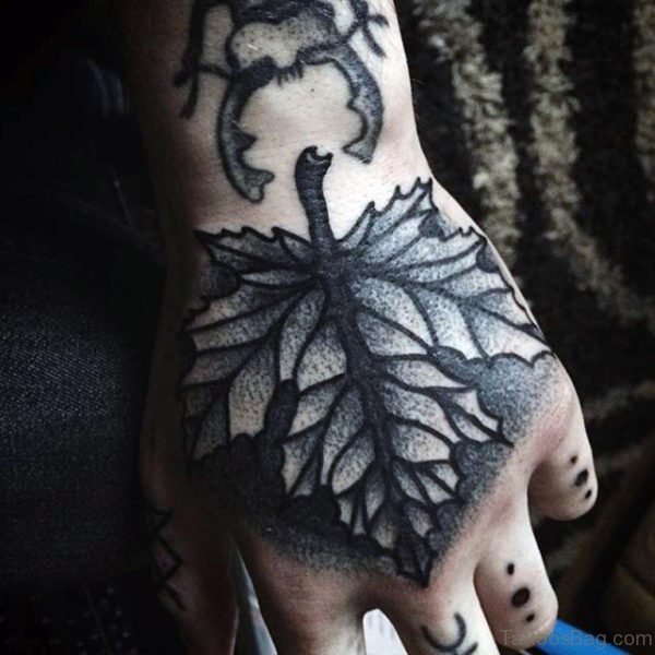Autumn Leaf Hand Tattoo