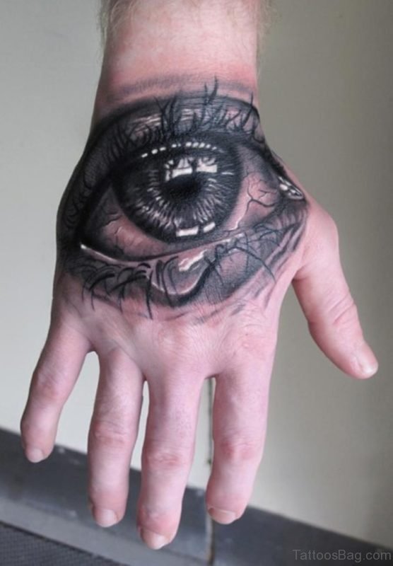 Black And Grey Crying Eye Tattoo On Hand