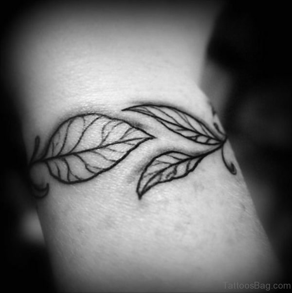 Black And White Leaves Tattoo On Wrist