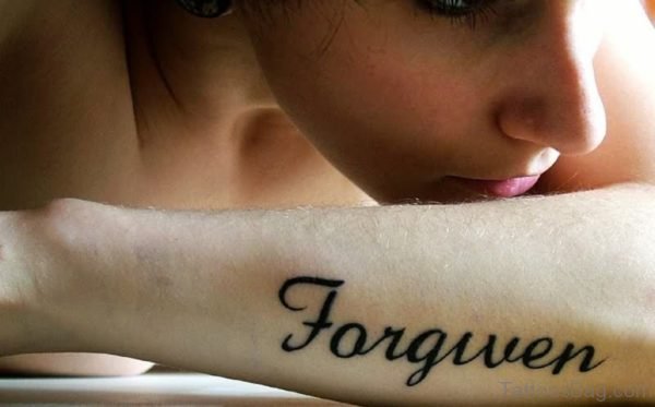 Black Forgiven Wrist Tattoo