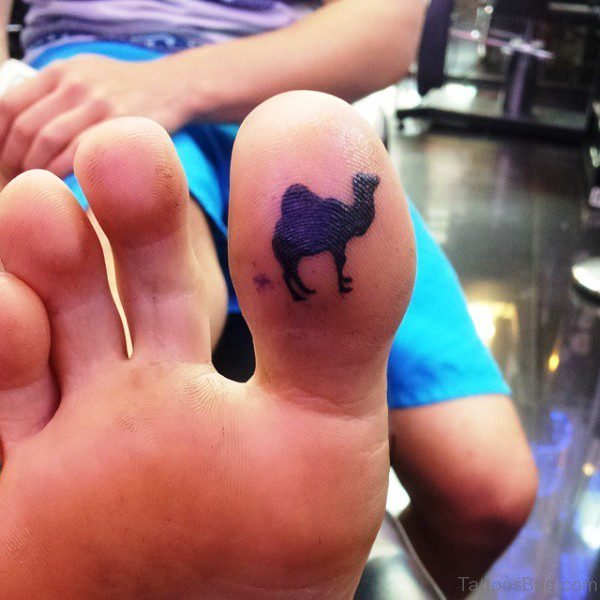 Black Inked Camel Tattoo Under Toe