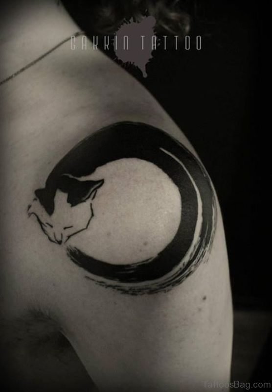 Black Zen Circle With Cat Face Tattoo On Shoulder