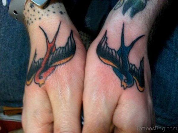Colored Swallow Tattoo On Hand