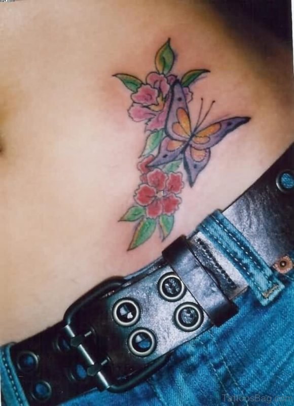 Colored flowers and butterfly tattoo on waist