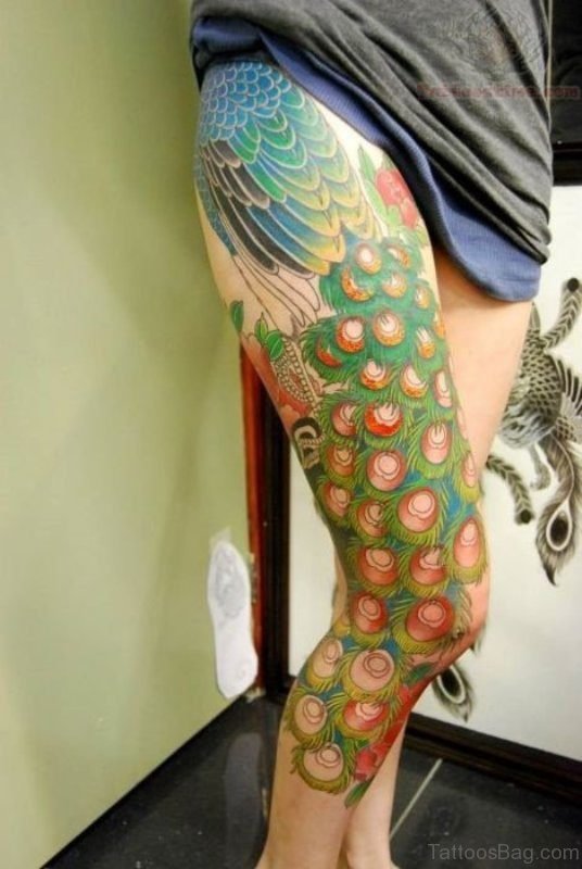 Dashing Peacock Feather Tattoo On Thigh