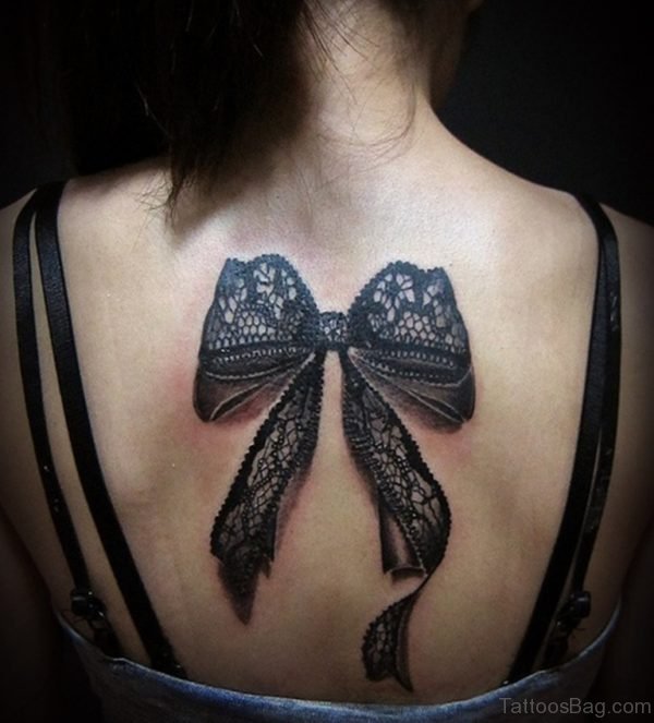 Feminine Bow Tattoo On Upper Back