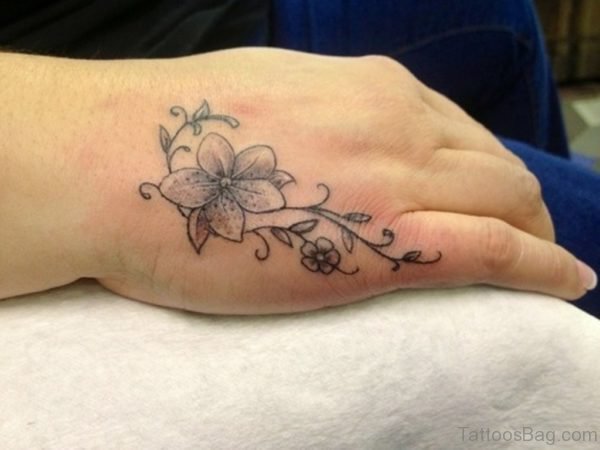 Flower Tattoo On Side Hand For Women