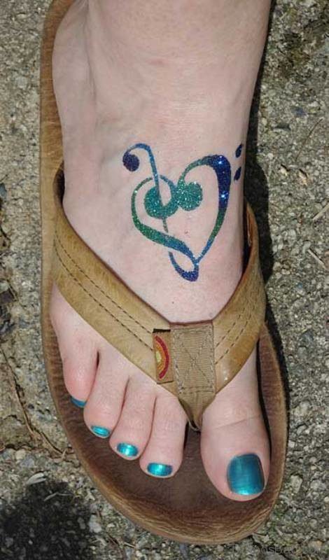 Glittering Musical Note Ttatoo On Foot