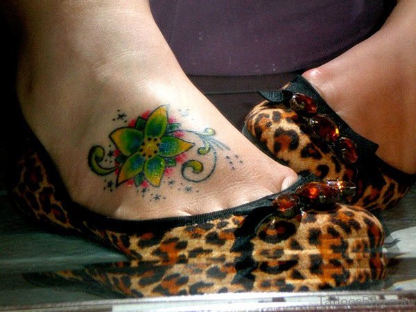 Green Flower Tattoo On Foot 