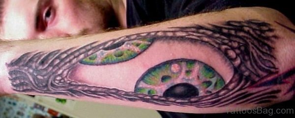 Green Ink Eye Tattoo