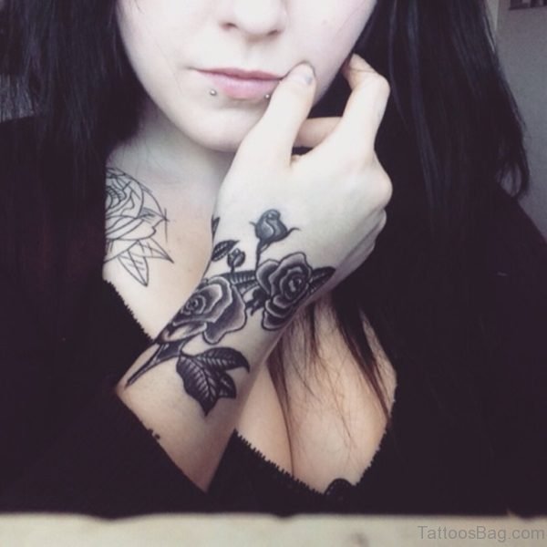 Lip Piercing And Flower Tattoo