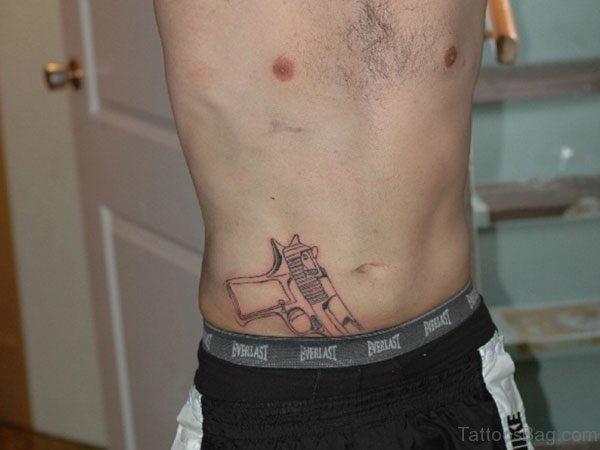 Pistol Tattoo On Stomach
