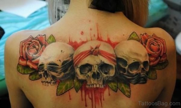 Skulls Tattoo On Upper Back