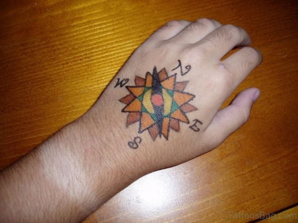 Small Colored Compass Rose Tattoo On Hand