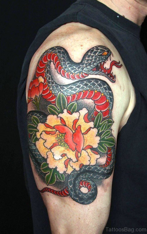 Snake With Flower Tattoo On Shoulder