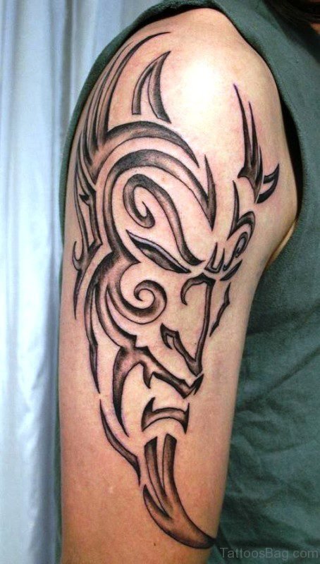 Tribal Devil Face Tattoo On Shoulder