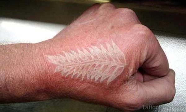 White Ink Feather Tattoo On Hand