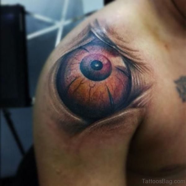 Abstract Brown Eye Tattoo On Shoulder
