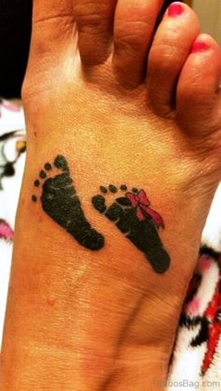 Black Baby Footprints Tattoo