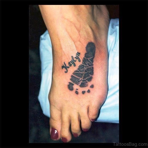 Black Inked Baby Footprint Tattoo
