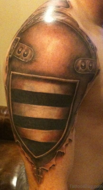Brown Armour Tattoo On Shoulder
