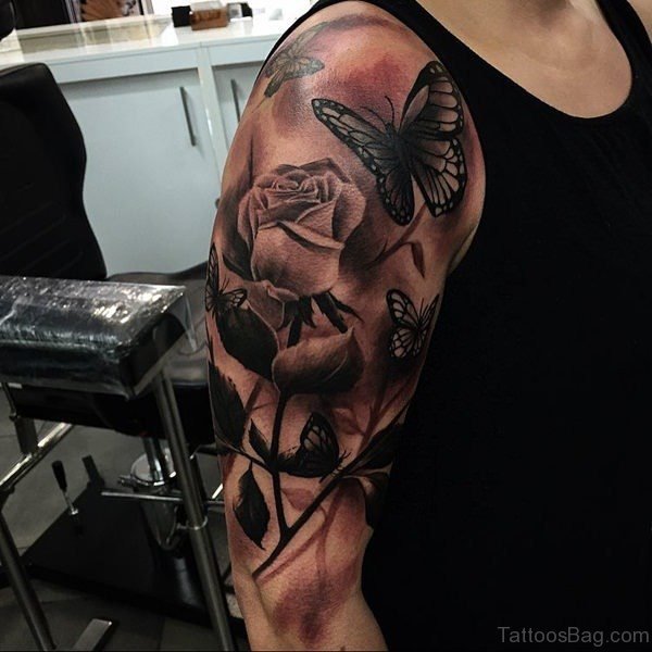 Brown Butterfly And Flower Shoulder Tattoo