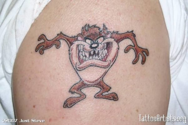 Brown Cartoon Tattoo On Shoulder
