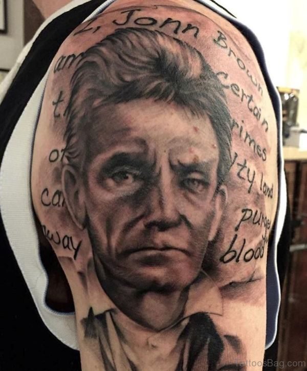 Brown Man Tattoo On Shoulder