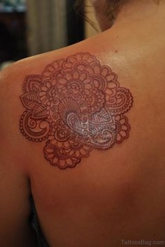 Nice Brown Designer Tattoo On Shoulder