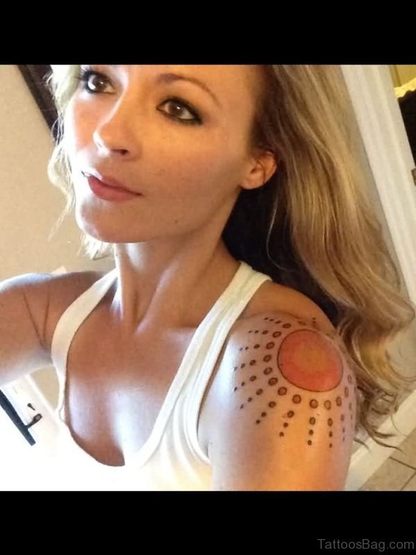 Nice Brown Sun Tattoo On Shoulder